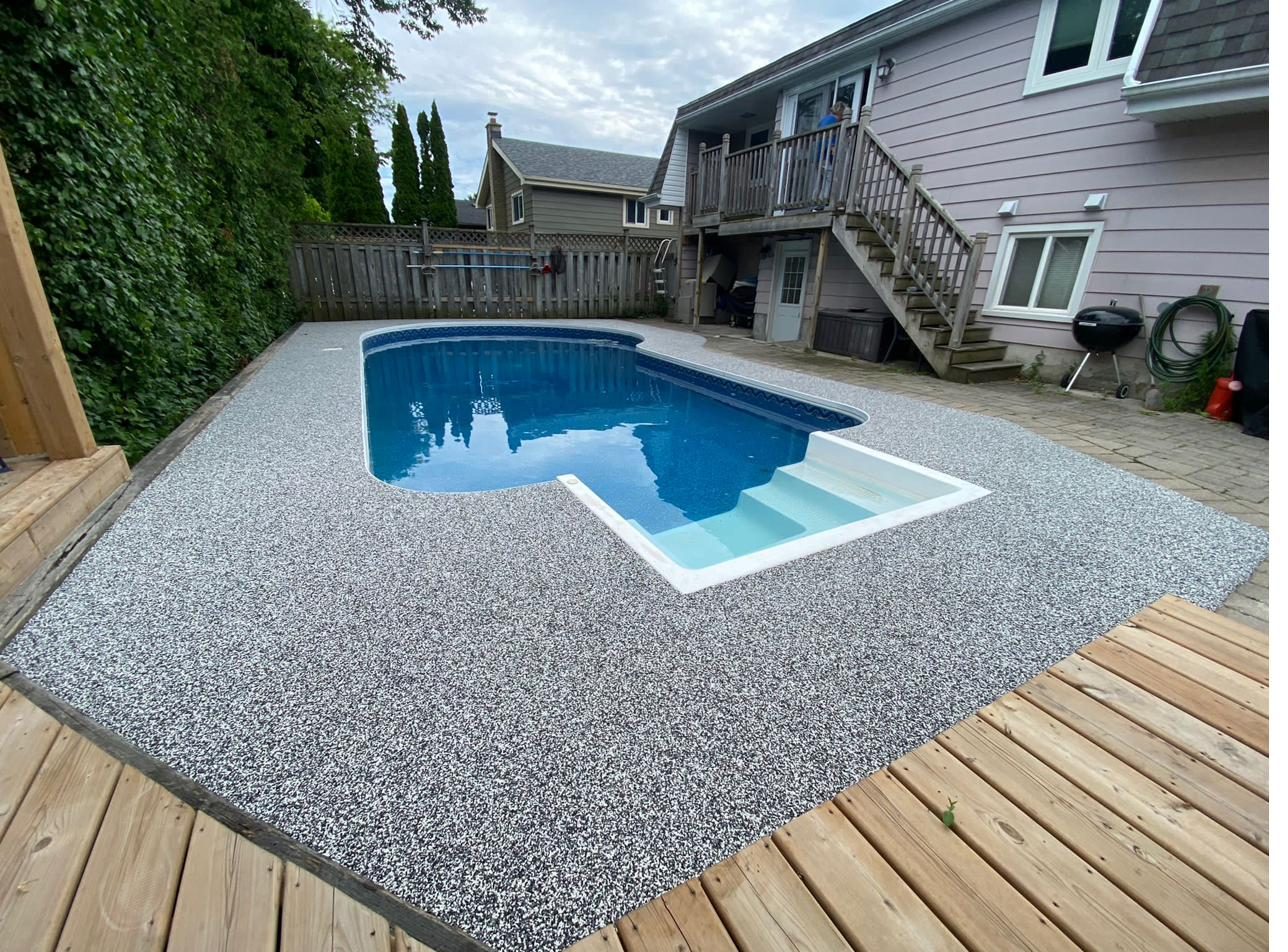 Indoor pool deck coated with slip resistant flake finish